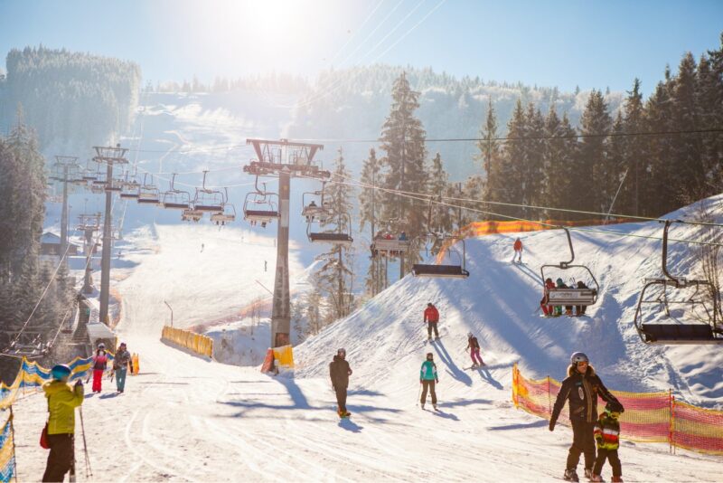skiers-on-the-ski-lift-riding-up-at-ski-resort-1